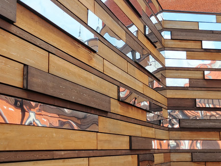 Detail of the facade of a modern building made of wooden planks