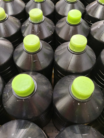 Plastic bottles with green caps, closeup of photoの写真素材