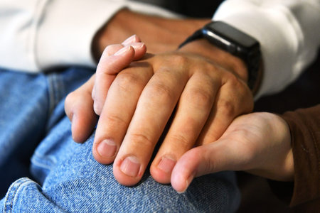 Man and woman holding hands. Close up of hands of man and woman