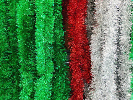 Colorful christmas tinsel as background, closeup of photoの写真素材