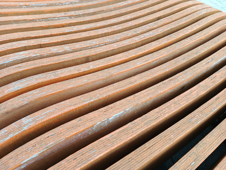 Wooden bench in a park, close-up. Abstract backgroundの写真素材