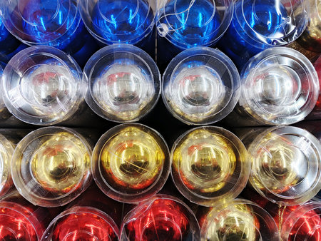 Colorful plastic cups in a market, closeup of photoの写真素材