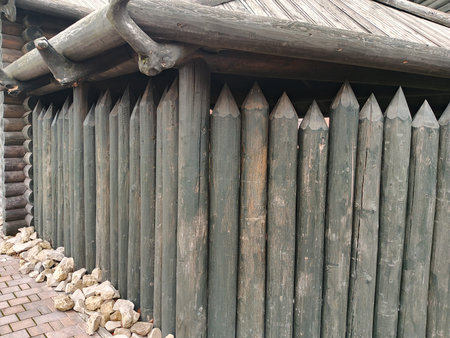 Wooden fence in the village, close-up of a fence