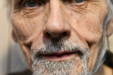 Close up portrait of an old man with a white beard and mustacheの写真素材