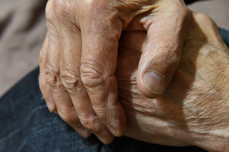 Close up of hands of an elderly woman, shallow depth of field