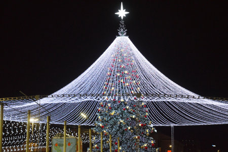 Christmas tree in the city at night, closeup of photo.の写真素材