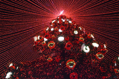 Christmas tree made of red glass balls in the shape of a heartの写真素材