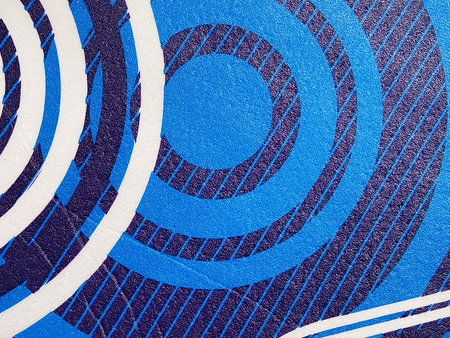 abstract background: blue and white concentric circles on a blue background