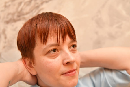 Portrait of a red-haired girl with freckles.の写真素材