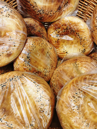 Bread with poppy seeds in plastic bag, closeup. food background
