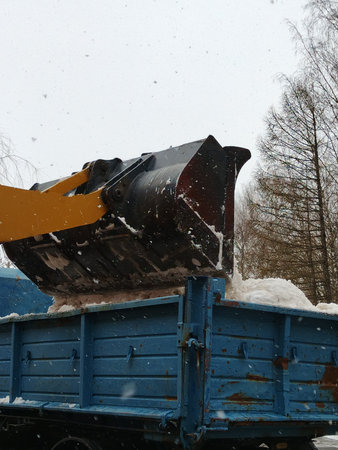 truck with snow cleaning the road in winter, Moscow, Russia