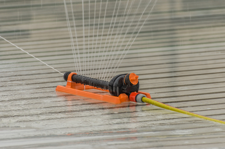 Water sprinkler for seasonal ice rinkの写真素材