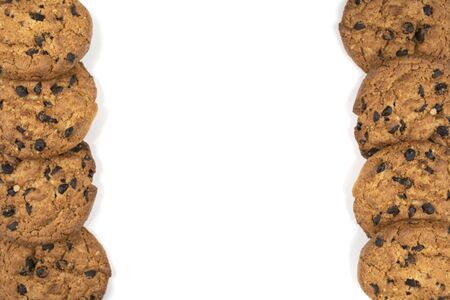chocolate chip cookies on a white isolated background, top view, text spaceの写真素材