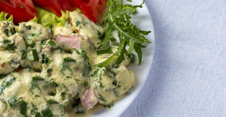 omelet on a plate with tomatoes, cucumber and lettuce, light texture backgroundの写真素材