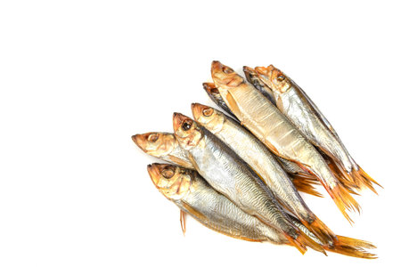 Delicious Baltic herring, hot smoked on a white isolated background, selective focus.Space for text .の写真素材
