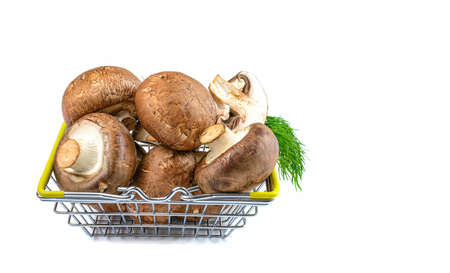 Mushrooms.Royal mushroom champignons in a shopping Mushrooms.Royal mushroom champignons in a shopping basket, close-up, isolated on a white background.The concept of buying healthy food.の写真素材