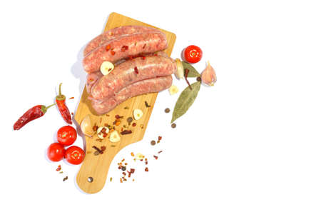 Raw pork sausages.Grilled sausages in close-up, isolated on a white background.Selective focus.の写真素材