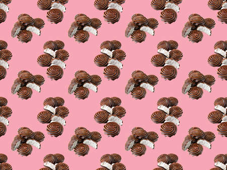 Seamless pattern.Chocolate-covered marshmallow close-up, isolated on a pink background.Selective focus.Horizontal view.の写真素材
