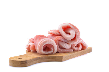 Raw sliced pork steak isolated on a white background.selective focusの写真素材
