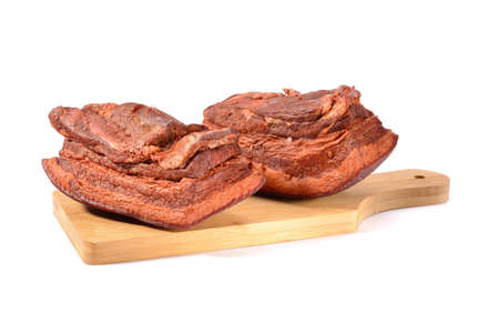 Pork fat.A piece of homemade boiled brisket with meat layers is isolated on a white background.horizontal view.の写真素材