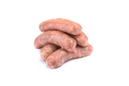 Raw pork sausages.Grilled sausages in close-up, isolated on a white background.Selective focus.Horizontal view.の写真素材