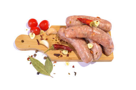 Raw pork sausages.Grilled sausages in close-up, isolated on a white background.Selective focus.Horizontal view.の写真素材