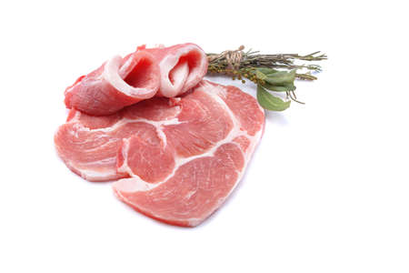 Raw sliced pork steak isolated on a white background.selective focusの写真素材