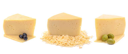 A piece of hard yellow cheese with olives, close-up, isolated on a white background.selective focus.の写真素材