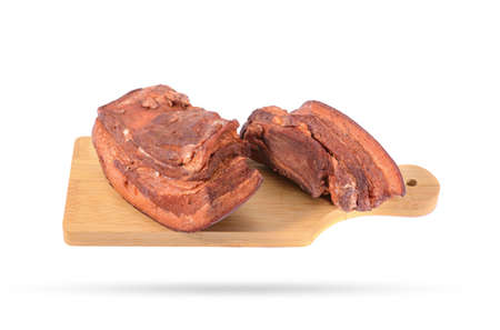 Pork fat. A piece of homemade boiled brisket with meat layers is isolated on a white background.horizontal view.の写真素材