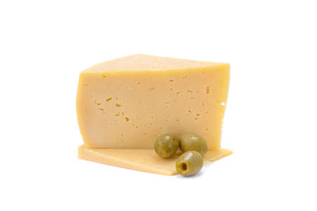 A piece of hard yellow cheese with olives, close-up, isolated on a white background.selective focus.の写真素材