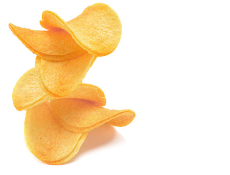 potato chips close-up isolated on a white backgroundの写真素材