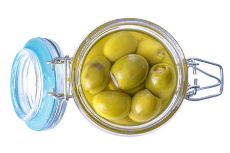 green pickled olives in a glass jar, isolated on a white backgroundの写真素材