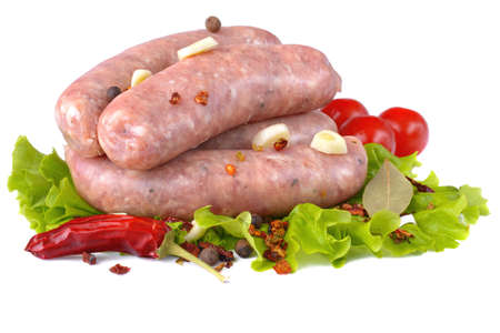 Raw pork sausages.Grilled sausages in close-up, isolated on a white background.Selective focus.の写真素材