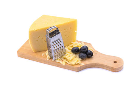 Solid yellow gouda cheese, close-up, isolated on a white background.selective focus.の写真素材