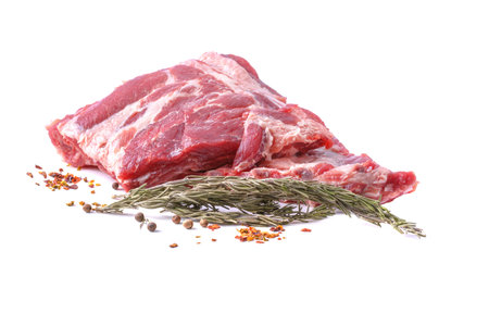 Raw pork ribs with spices are isolated on a white background.Preparation of meat dishesの写真素材
