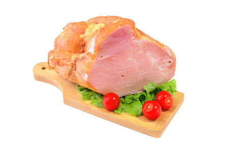 Smoked meat in a large piece on top with cherry tomatoes. Isolated on a white background.clipping pathの写真素材