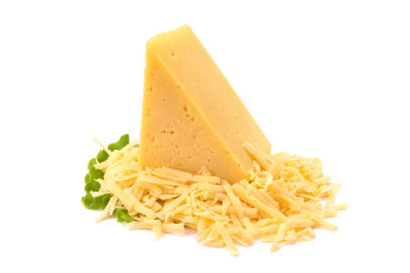 A piece of hard yellow cheese with olives, close-up, isolated on a white background.selective focus.の写真素材