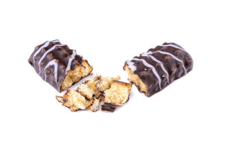 Broken chocolate chip cookies. Pieces and crumbs of a chocolate stick or bar are isolated on a white background. Top Viewの写真素材