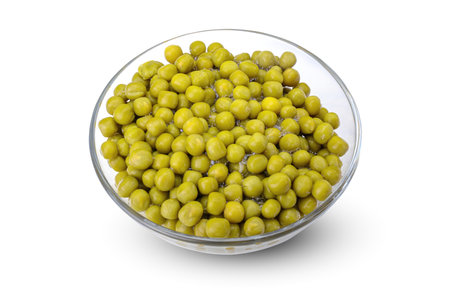 green canned peas in a glass bowl isolated on a white backgroundの写真素材