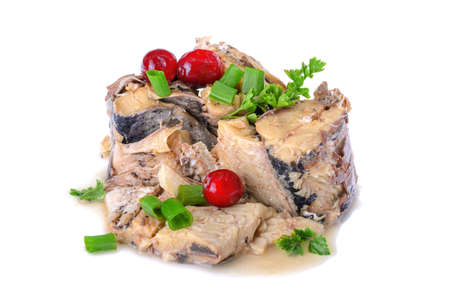 canned fish with cranberries and parsley is isolated on a white backgroundの写真素材