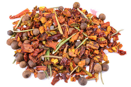 a mixture of crushed red cayenne pepper, dried chili flakes, rosemary, pepper. isolated on a white backgroundの写真素材
