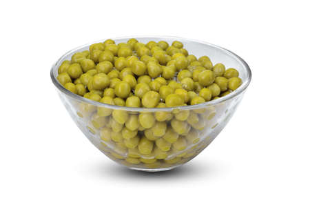 green canned peas in a glass bowl isolated on a white backgroundの写真素材