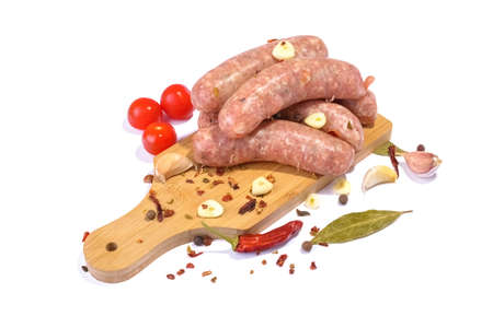 Raw pork sausages.Grilled sausages in close-up, isolated on a white background.Selective focus.Horizontal view.の写真素材