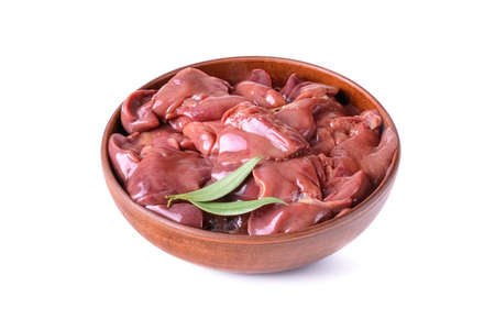 raw chicken or goose liver with bay leaf in a clay bowl close-up, isolated on a white background.の写真素材
