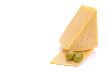 A piece of hard yellow gouda cheese with olives close-up, isolated on a white background.selective focusの写真素材