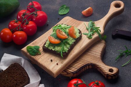 Avocado toast on whole grain sandwich bread. Healthy eating, dieting, vegan vegetarian foodの写真素材