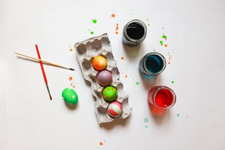 self made easter eggs desing, beautiful real messy composition, brushes and food paintsの写真素材
