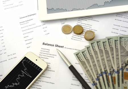 Balance sheet report chart smartphone and moneyの写真素材