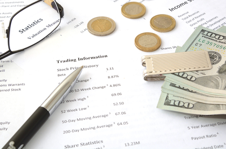 result of trading information account pen, glass and moneyの写真素材