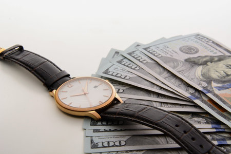 Time is money. Watch and dollars